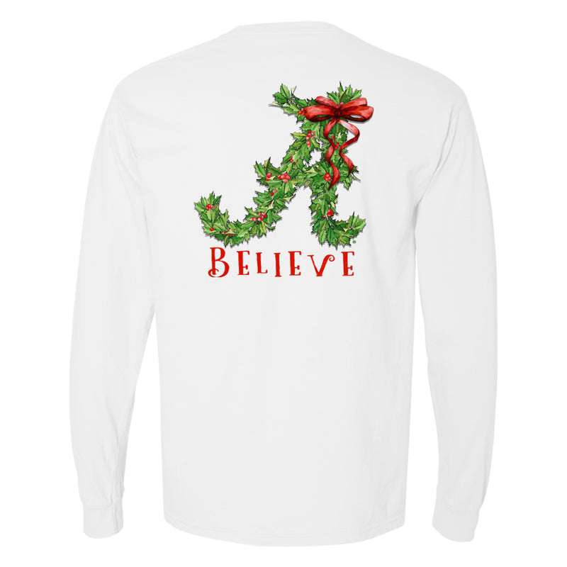 Women's Alabama Crimson Tide T-Shirt says Believe under a script "A" made of Christmas holly. Is a Comfort Colors long-sleeve and white.