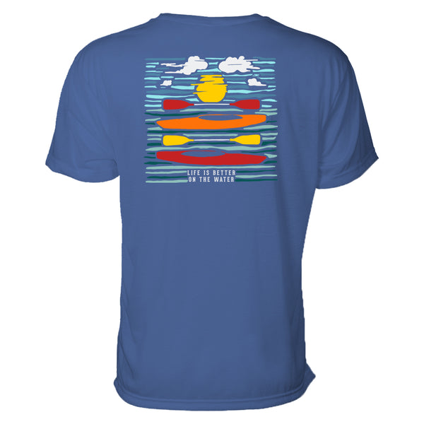 In this outdoors t-shirt, two kayaks balance with paddles in the ripples of the water where we see a reflection of the sun as well. Graphic design is colorful and looks almost like a wood print.