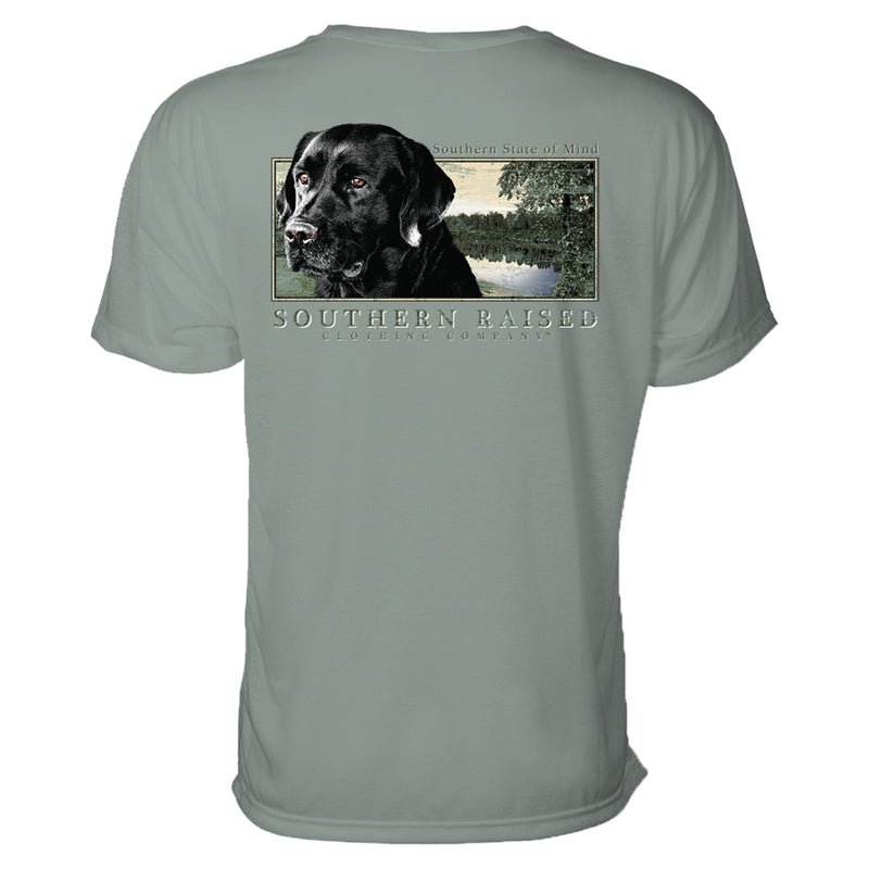 Southern State Mind t-shirt. Black Labrador Retriever and water scene graphic illustration on Comfort Colors t-shirt. Color is bay. Southern Raised Clothing Company